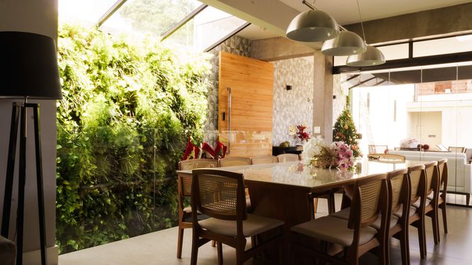 Indoor outdoor dining plant wall kitchen